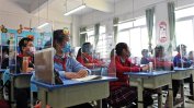 Китайски гимназисти ще бъдат наблюдавани за коронавирус с електронни гривни